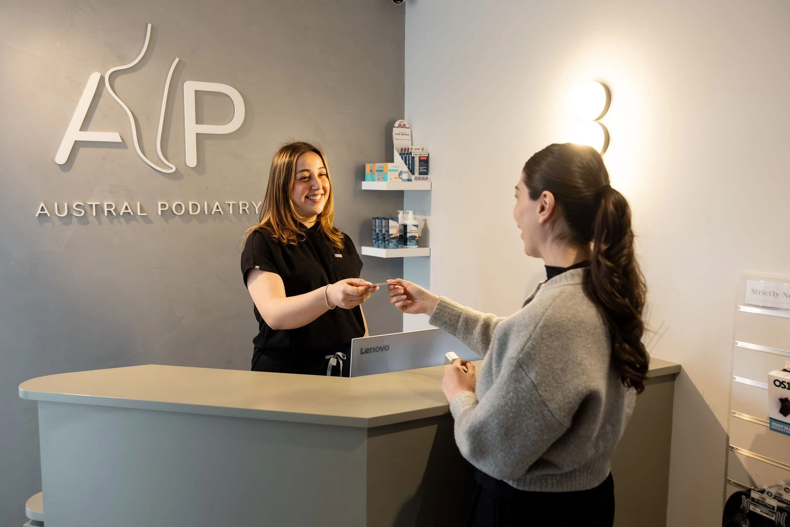 patient taking information for podiatry treatment at podiatry clinic in austral, nsw