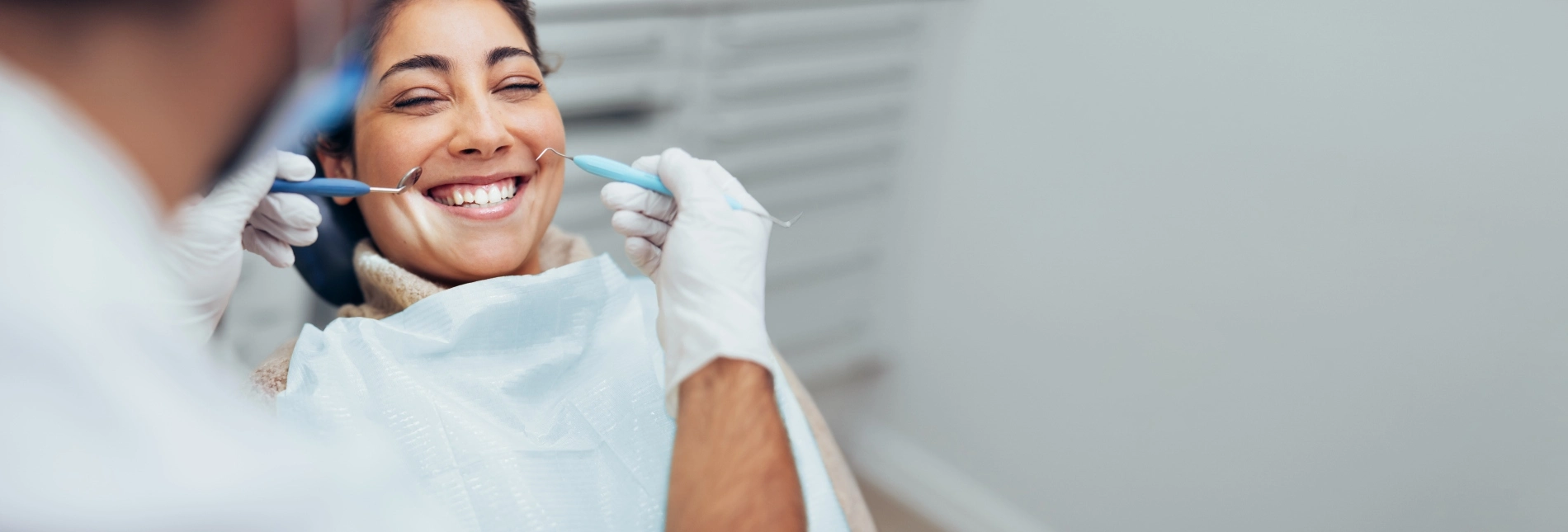 patient smiling during checkup with dentist in mississauga
