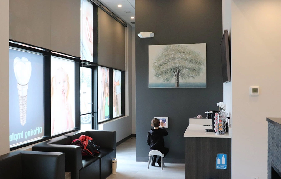 bright clinic hallway with glass doors at dentist near you