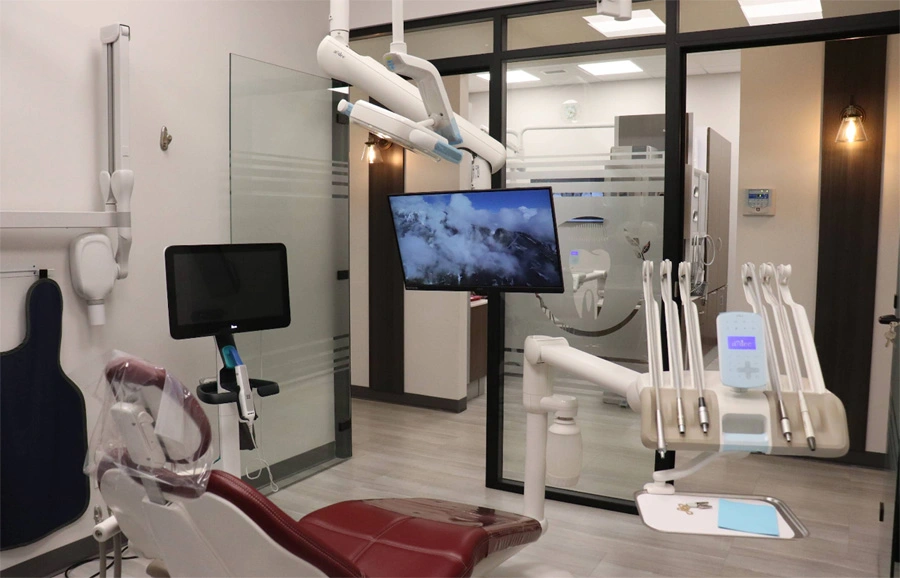 fully equipped dental chair and treatment monitor at dental clinic in leduc, ab