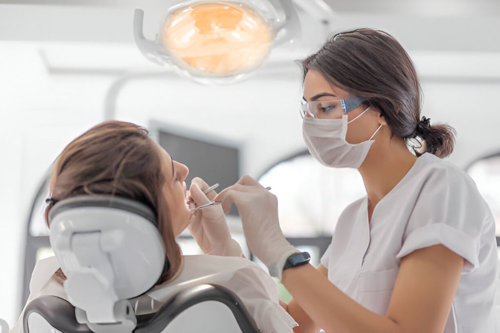 Patient receiving dental cleaning during a routine checkup in Keswick clinic.