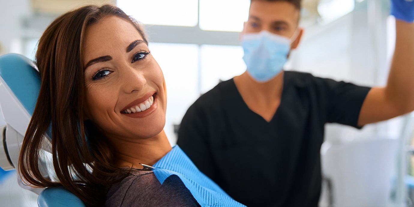 Smiling patient with dentist beside her at a dentist near you in Smiling patient with dentist beside her at a dentist near you in Keswick.