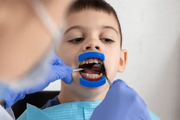 child receiving a routine dental checkup